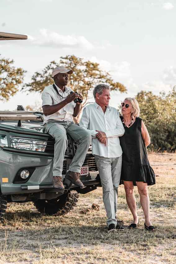 Guide with guests on a game drive in Hwange