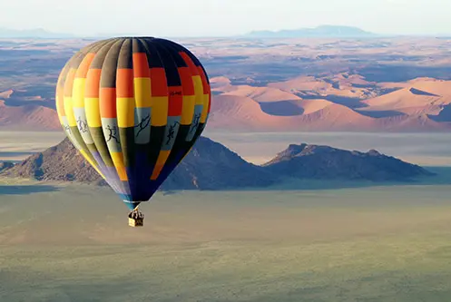 Sunrise hot air balloon flight over the Namib