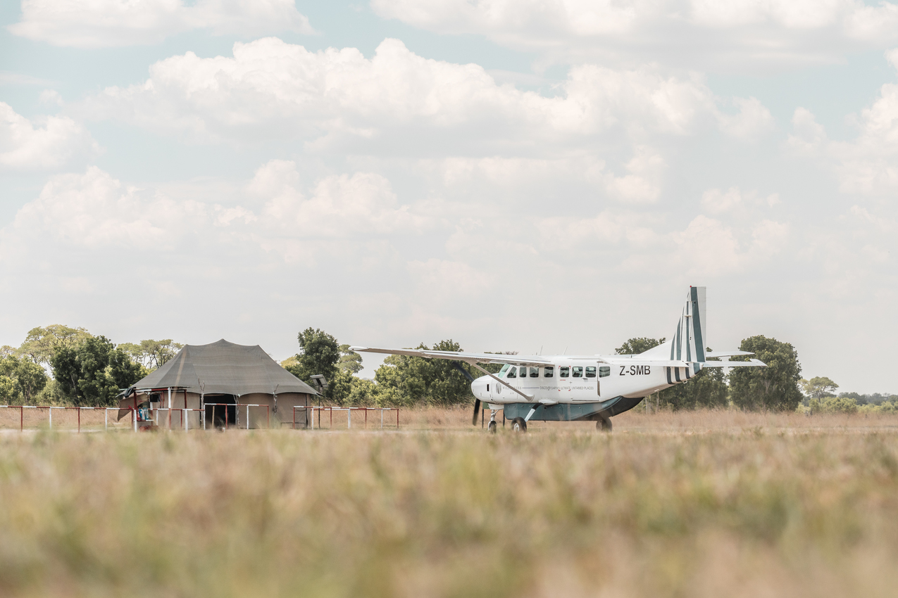 Light aircraft and safari tent in Hwange