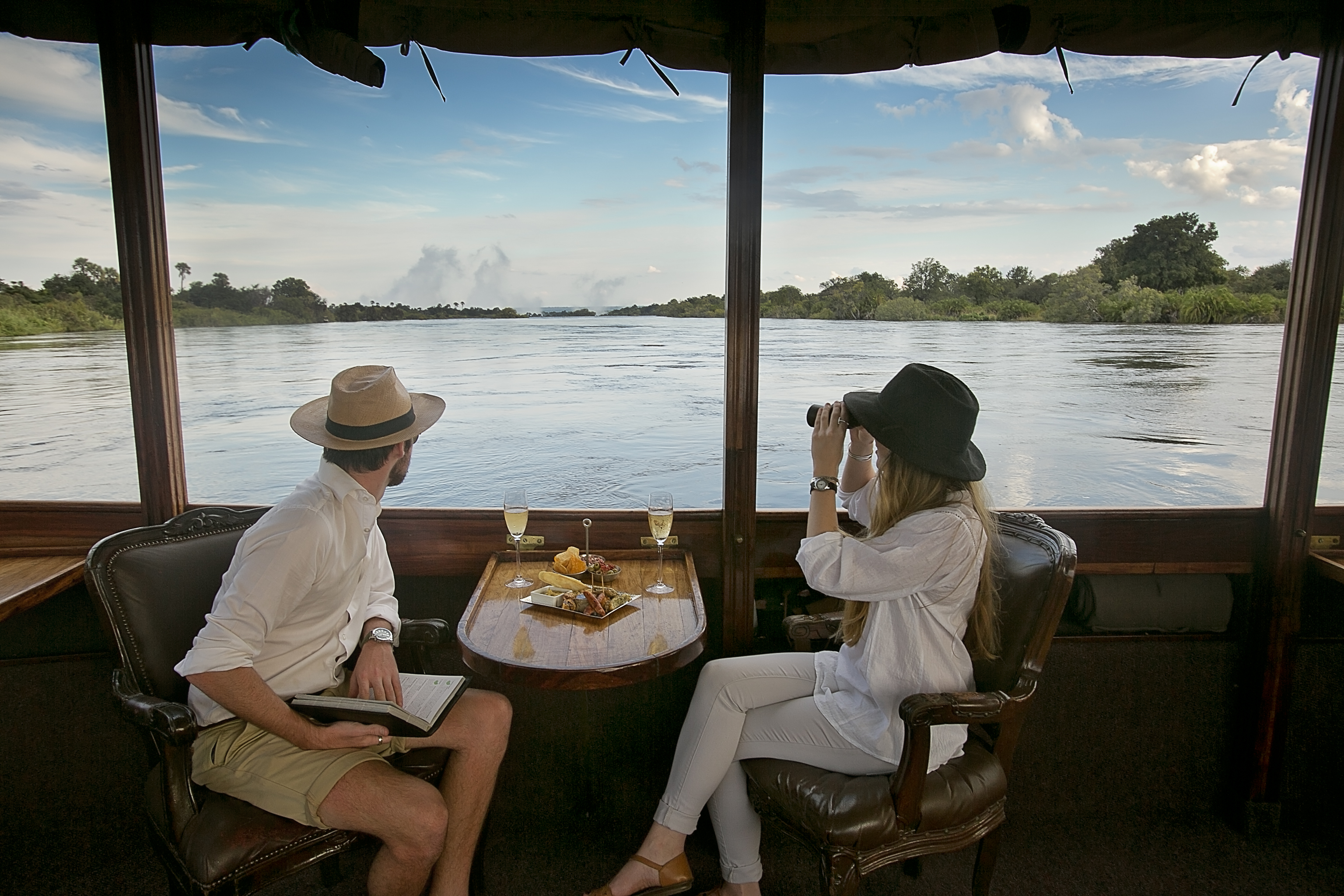 Couple enjoying a Zambezi sunset cruise